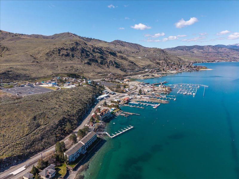 Stunning aerial view of the lakefront marina and surrounding hills—your vacation rental is nestled in this beautiful waterside community.