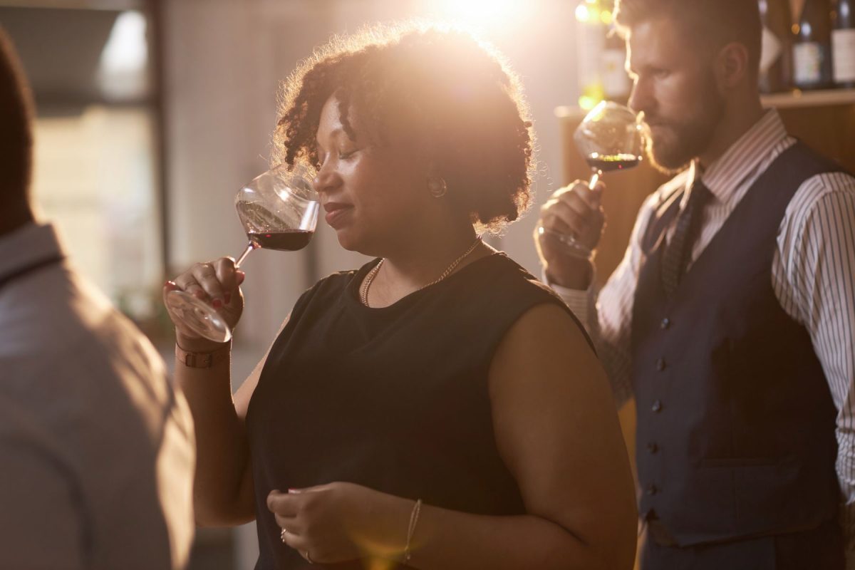 Woman enjoying the nose of a red wine during a tasting