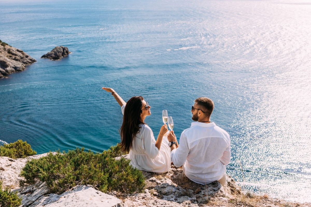couple having drinks on the coast